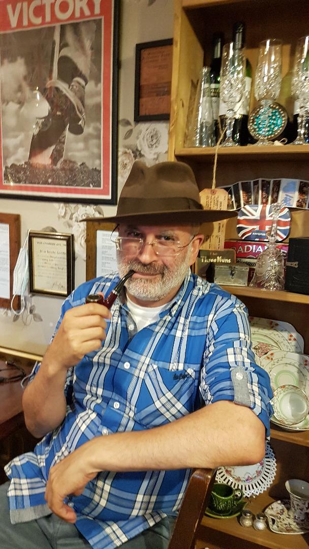 © Ardeshir Vahidi Ardeshir Vahidi in playful pose with hat and pipe